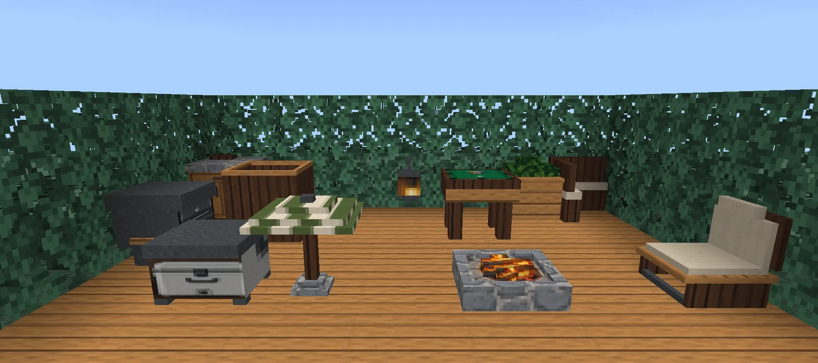 A Minecraft backyard deck of timber decking with a hot tub, a pool table, a gas grill, a sunken fire pit, a sun lounger and a canvas parasol
